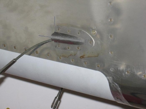 Rudder control cable fuselage exit fairing installed