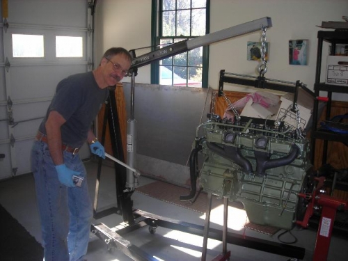 Jim lifting the Austin Healey engine with an engine hoist