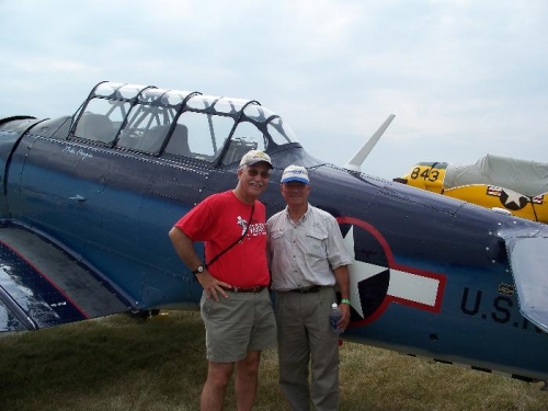 Me with Mike Pangia, a famous aviation attorney, in front of his WWII SNJ