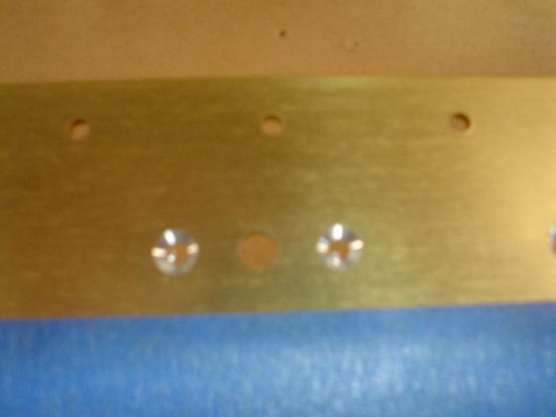 Closeup of the countersunk platenut attachment holes.  The center hole gets countersunk later.