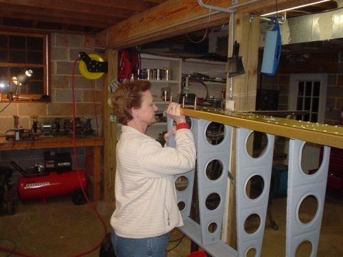 Vicki helping lift the wing into the jig