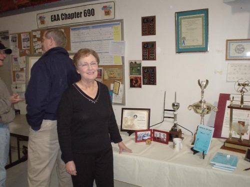 Pauline Mallary next to some of her racing trophies