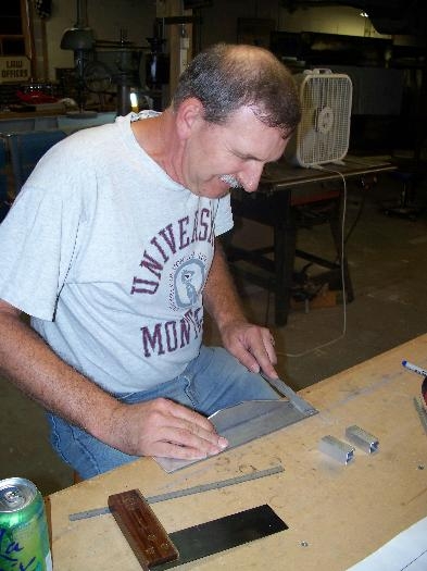 Jim Weed, filing the control column hanger assembly