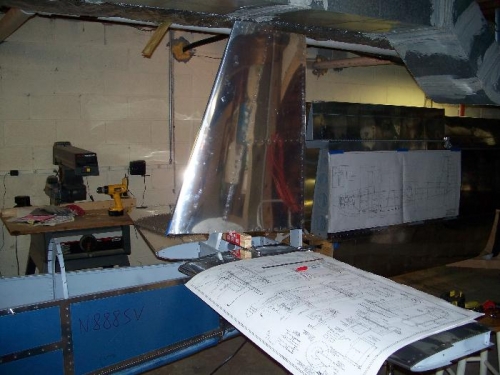 Vertical stabilizer clamped in (note drawings with tear stains)