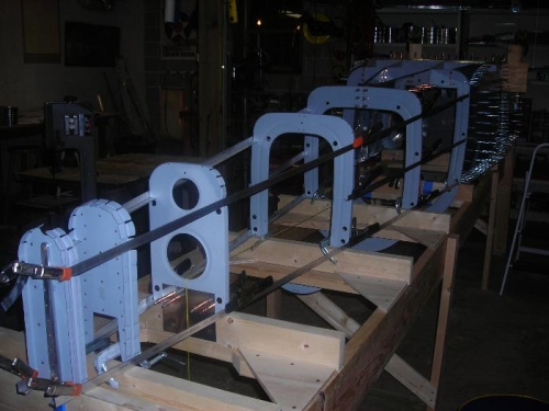 The fuselage bulkheads with the lower and mid level longerons clamped in