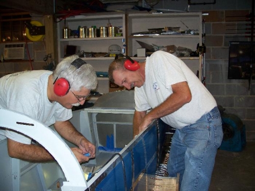 Jim Weed and I working on riveting the arm rests in