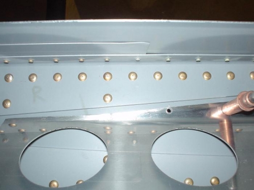 Rivet hole too close to the edge on the right wing flap brace