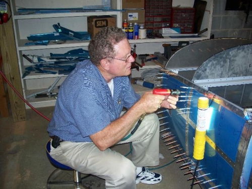 Sam Beale drilling the forward baggage bulkhead to the fuselage skins