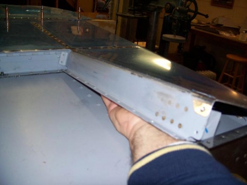 Squeezing my hand under the rib to buck the rivets