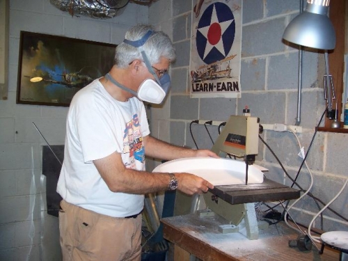 Cutting the fiberglass rear seat cap with a band saw