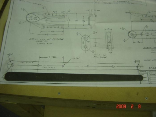 Wing strut attach fitting compared to full size drawing