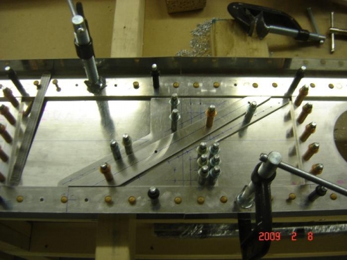 splice plate and spacer bar drilled in place