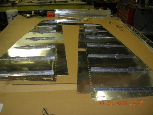 Stiffeners rivetted to skins