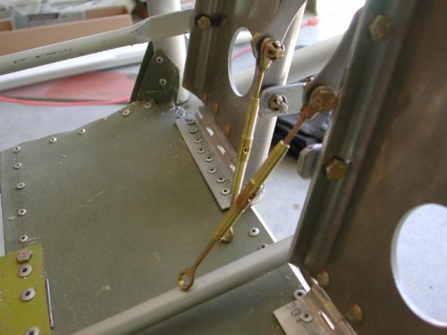 Turnbuckles attached to fwd rudder pedals