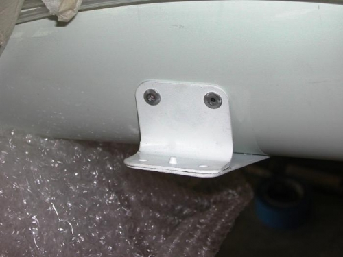 Tail strut bracket riveted in place