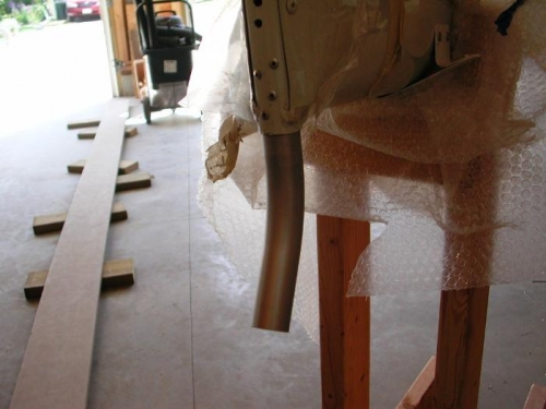 Tail skid riveted in place