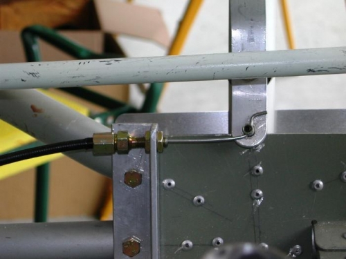 Trim control cable at handle end