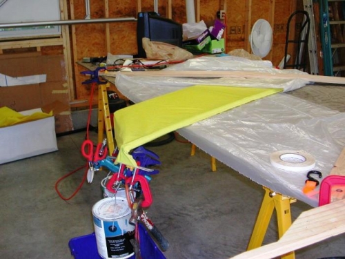 Weights to stretch fabric taut