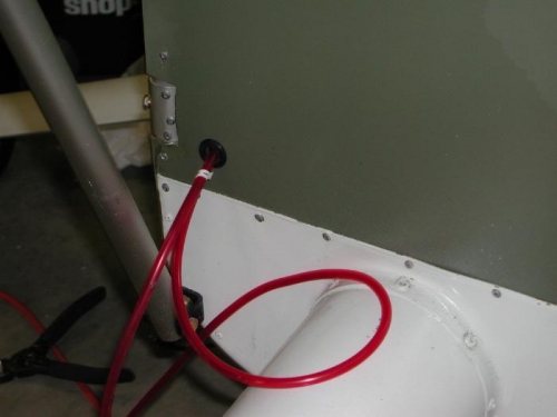 Primer tubing thru fire wall