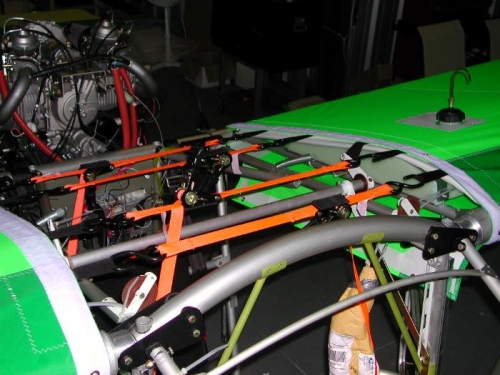 Ratchet straps applied to wing fabric