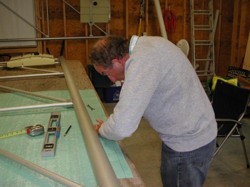 Cutting foam strips.