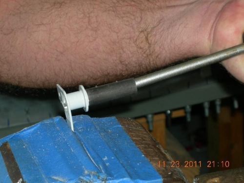 Bending the 10 degree down in the trim actuator arm.