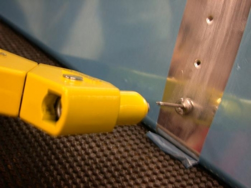 Put on the pop rivet tool and squeeze to dimple