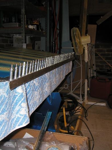 The axe wedge installed after being smeared with proseal and clecoed to a strait aluminium angle