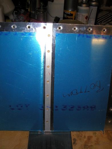 Getting ready to rivet stiffeners into place