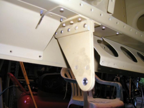 Inboard bracket riveted in place