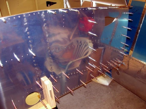 Started on the riveting of the vertical spar supports right side