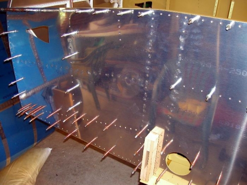 Started on the riveting of the vertical spar supports left side