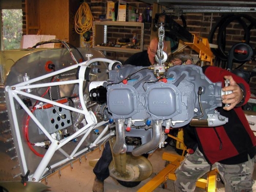 Top left bolt in, lining up for the top right