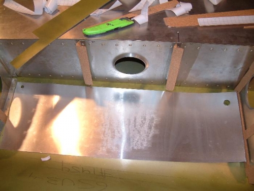 Template in cavity to mark holes for tank.
