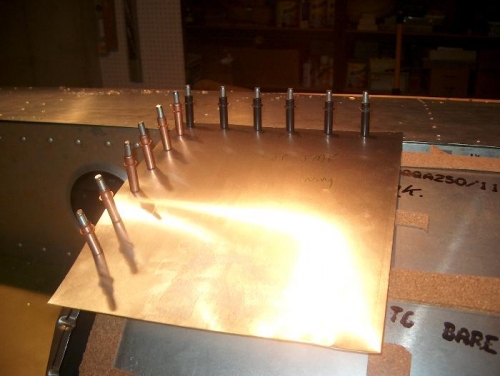 Template clecoed in place for measurements.