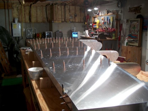 Rear skin drilled through ribs