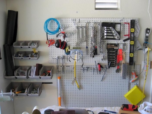 Main pegboard, wall trays...need to hang more tools.  Also have a Craftsman rollabout tool chest.