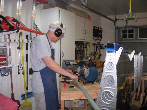 Sanding the end on the rotary sander  to the exact length.