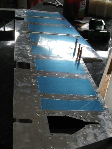 Underside of the left elevator.  The opening is for the electric trim tab motor.