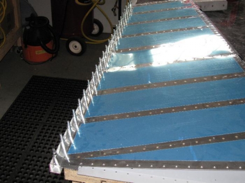 The aluminum angle in place to keep the trailing edge straight..