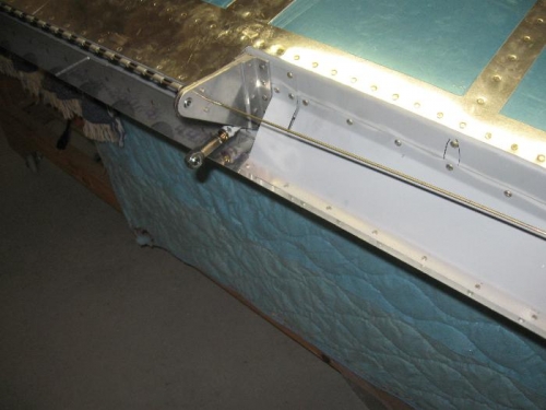 There is now a hole in the aileron attach points to slide the pin for the flap hinge.