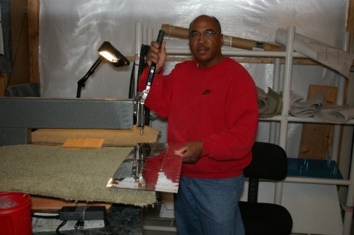 Reggie the riveter is dimpling the doubler for the top wing skin