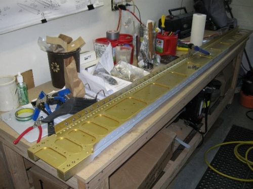 Right main spar drilled, countersinked, and spot primed.