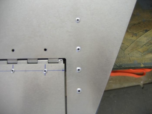 inboard side of trim tab (note the space for the safety wire to travel).