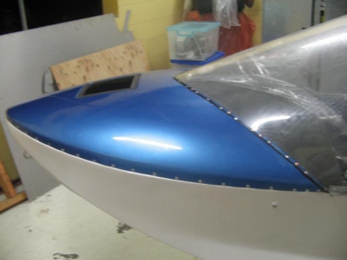 nose deck and windshield riveted in position