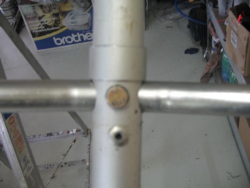 arm refitted with retainer ring and extra rivet