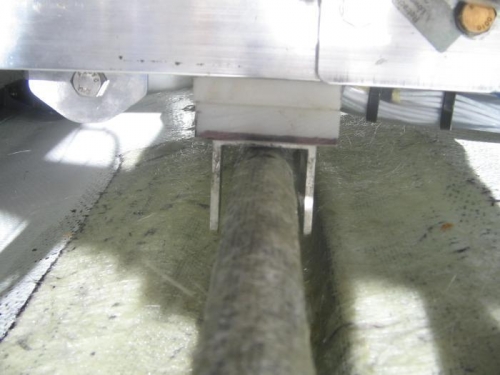 bolt head and channel bracket sitting on top of stringer