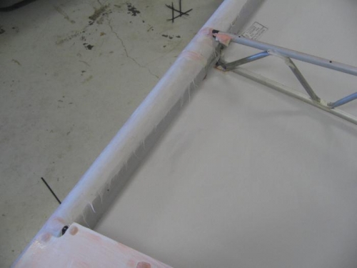 fabric wrapped around and glued to trailing edge