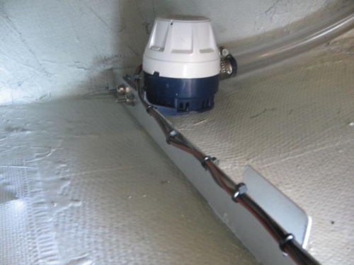 bilge pump in position with wiring attached and waste hose fitted