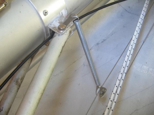 nylon pulley on spring to take up slack in extension cable.